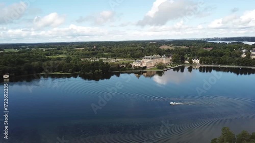 Drottningholm Palace aerial drone view, Stockholm Sweden, UNESCO World Heritage site with lake reflection, baroque architecture and scenic summer landscape