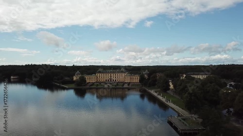 Drottningholm Palace aerial drone view, Stockholm Sweden, UNESCO World Heritage site with lake reflection, baroque architecture and scenic summer landscape