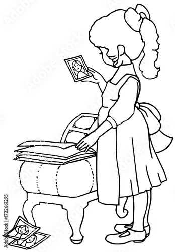Nostalgic girl cherishes old photographs and memories, looking through treasured family album with joy and wistful reflection
