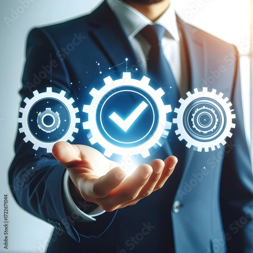 Man in a suit holds glowing gears with a checkmark. Focus is on the hand & gears. Blur creates a sense of depth and modern style