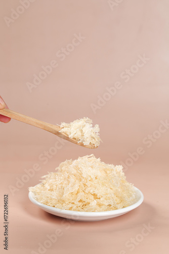 White Tremella Silver Ear Fungus on Wooden Spoon Traditional Chinese Medicine Ingredient
