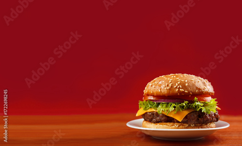 Hamburger on a wooden background.