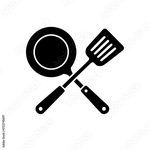 Minimalistic black silhouette of frying pan and slotted spatula crossed