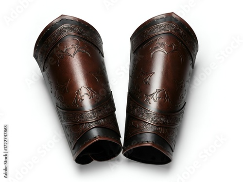 Pair of ornate leather armguards, isolated on white, perfect for fantasy or historical themes