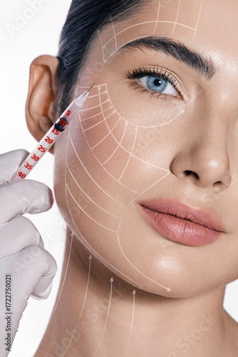 Beauty injections, lifting lines on a woman's face, advertising of skin tightening. Injections in eye area, nasolabial folds, forehead