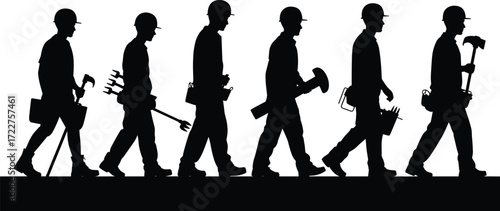group of construction workers walking carrying tools silhouettes teamwork labor industry workforce hammer spanner wrench hardhat safety gear building site occupation profession engineering