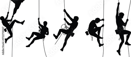 Silhouette of rock climbers ascending ropes, adventure sports concept, extreme outdoor activity, teamwork, mountain climbing, fitness challenge, black and white.