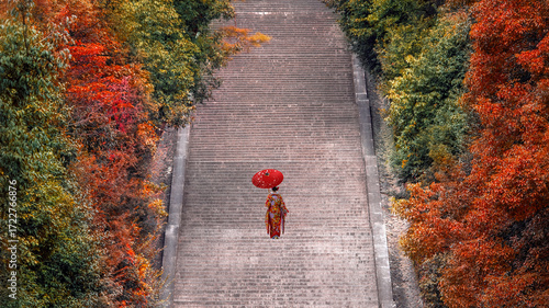 Japanese Woman in Traditional Kimono Dress at The Mausoleum of Emperor Meiji in Kyoto, Japan
