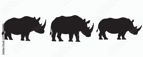 Silhouettes of rhinoceroses in different stances, isolated on white background. Vector illustration for wildlife, safari, and animal conservation themes.