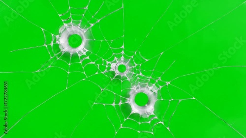 Bullet holes in glass effect on green screen, chroma key ready. Perfect for VFX, motion graphics, overlays, cinematic action scenes, and gaming or urban visuals.