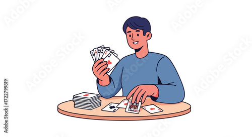 A cheerful man sitting at the table enjoys playing cards and organizes the cards in his hand for entertainment and amusement