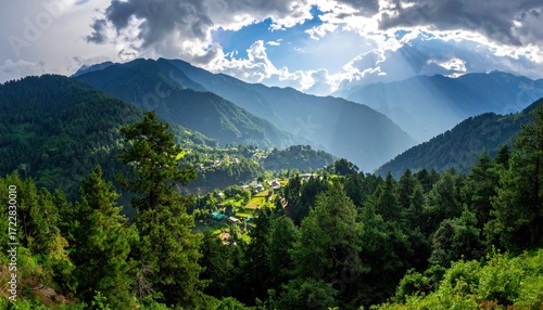 Verdant mountain vista rolling hills, a village nestled amid trees, sky, and sunbeams filter through clouds, creating a scenic, peaceful landscape