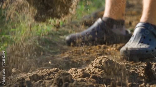 Wallpaper Mural The process of digging the soil of a garden bed with a shovel, close-up in slow motion Torontodigital.ca