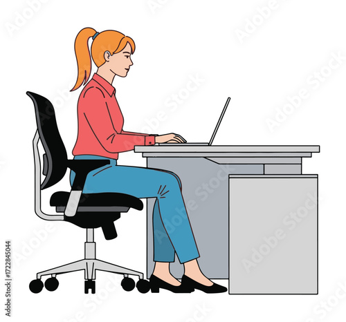 Woman sitting at a desk, typing on a laptop, in an office environment.