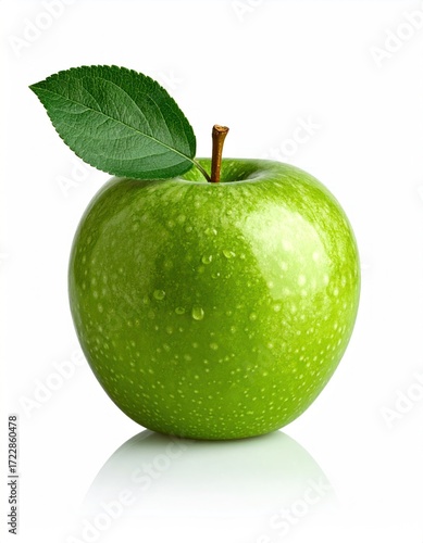 A vibrant green apple, complete with stem and fresh leaf, glistens with small droplets against a bright white background creating a crisp image