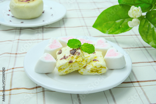 Close-up of desserts on cloth pattern background, marshmallow, depth of field