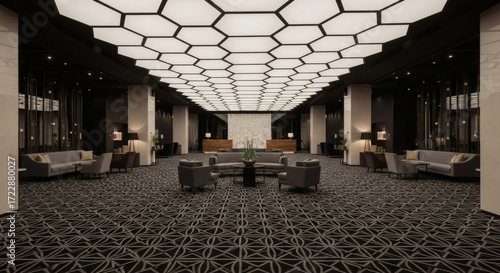 Luxurious hotel lobby with a striking hexagonal ceiling design, comfortable seating areas, and a grand reception desk, exuding modern elegance and sophistication.