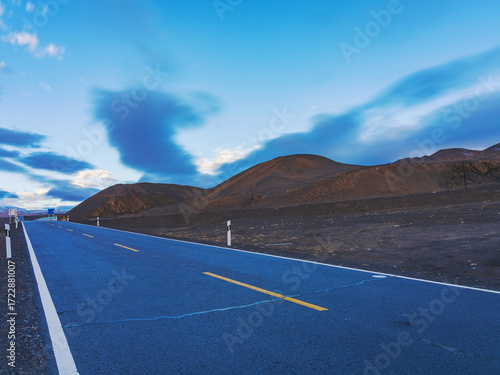 Snow capped mountains, plateau highways, and pastures in the western mountainous areas of Sichuan, China On September 30th, 2024