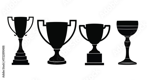 Set of four silhouette trophies and awards representing victory success and achievement vector