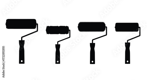 Four black paint rollers in a row set against a vector