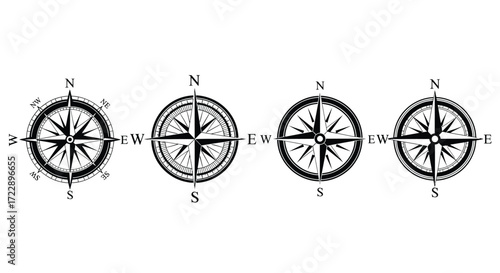 Four vintage style nautical compass rose designs for navigation and exploration art vector