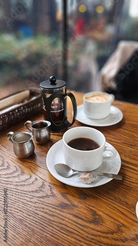 Fotografie Close-up of hot drip coffee with cream sugar pearl pancake and caramel crème brû