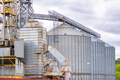 Close-up on steel grain silo in the fields. Photo taken in natural lighting, soft light