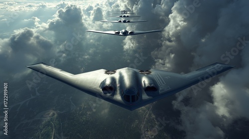 Military aircraft flying in formation over a cloudy landscape during daylight hours