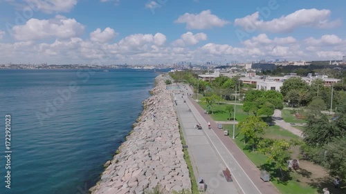 Wallpaper Mural Aerial view of a coastal park with trees, walking paths, and residential buildings beside the sea. Torontodigital.ca