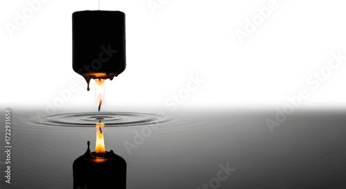 Melancholic candle reflection with dripping wax illuminating a fluid dark mirror backdrop