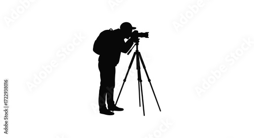 Photographer with camera and tripod against a white backdrop silhouette