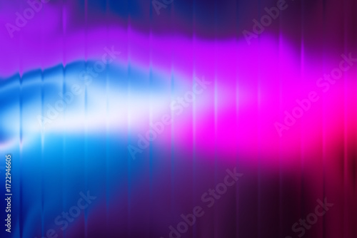 Abstract vibrant glowing light streaks in electric blue and magenta against a dark background