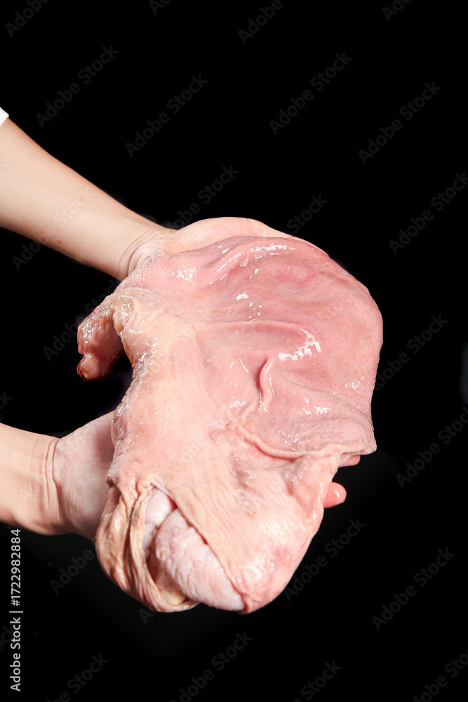 Fototapeta premium Raw Pork Belly Cut in Hands - Fresh Meat for Cooking on Black Background