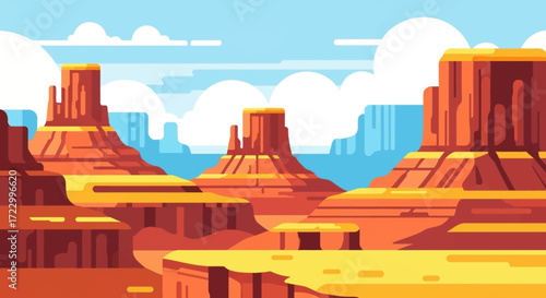 Vast desert landscape with towering rock formations under a clear sky.