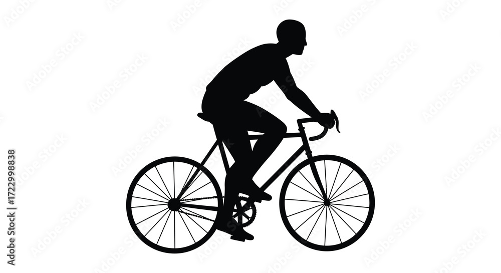 Fototapeta premium A cyclist riding a road bike in a dark striking silhouette
