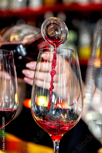 When pouring red wine into a glass