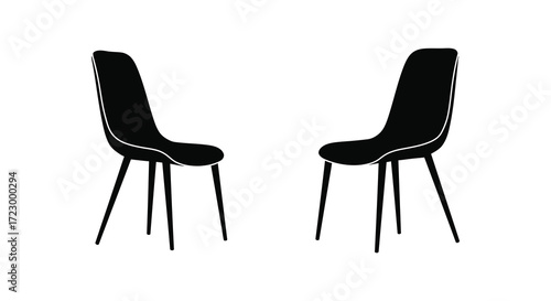 Two modern dining chairs presented in a striking black silhouette