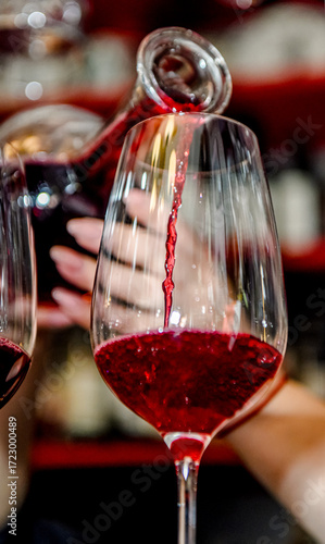 When pouring red wine into a glass
