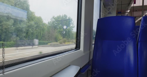The Hague, Netherlands, August 26, 2025. Empty seats inside Dutch train heading for The Hague. Wide angle view, blue upholstery, real time, no people