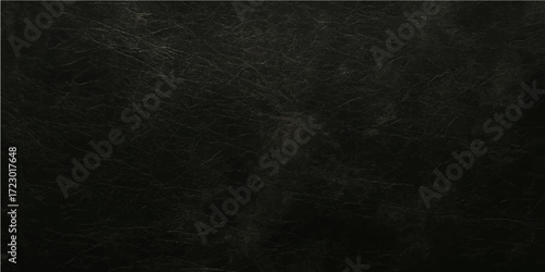 An old, dark black chalkboard with a textured grunge surface provides a blank backdrop for vintage design