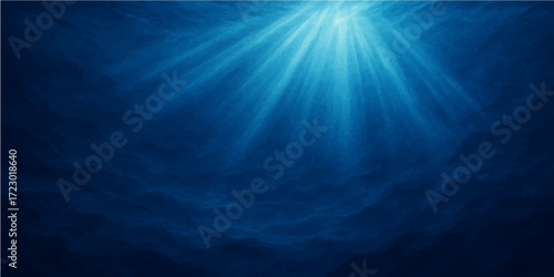Deep blue underwater sunlight rays burst through the sea