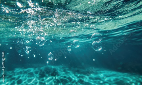 Underwater scene with bubbles rising and sunlight filtering through the water
