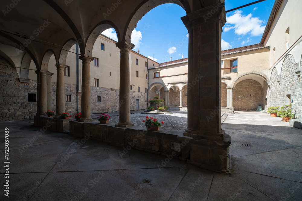 Naklejka premium Cloister of Abbazia di San Salvatore, romanesque styled medieval church in Tuscany, Italy