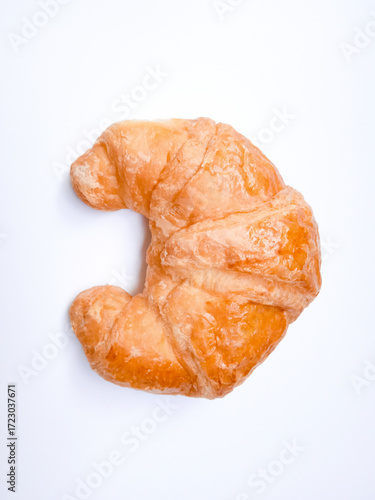 Golden, flaky croissant on a white background. Freshly baked with glossy layers and a perfect crescent shape. Simple, elegant, and irresistibly crisp.