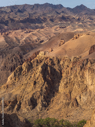 Breathtaking Kazakh canyon with fiery rock layers and dramatic erosion-carved contours.
