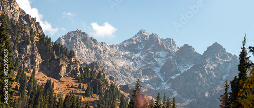 Untouched Kazakh wilderness showcasing mountain grandeur and pastoral valley beauty.