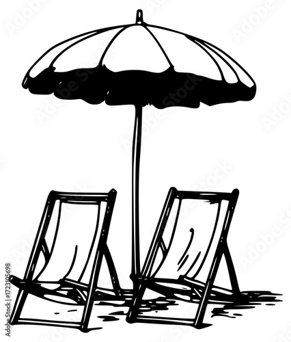 Beach umbrella and sun loungers on the sand