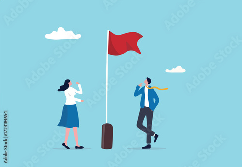 Red flag warning to be careful for business or economic disaster, advice, notice or caution, attention or alert for threat concept, thoughtful businessman and businesswoman look at red flag warning. 