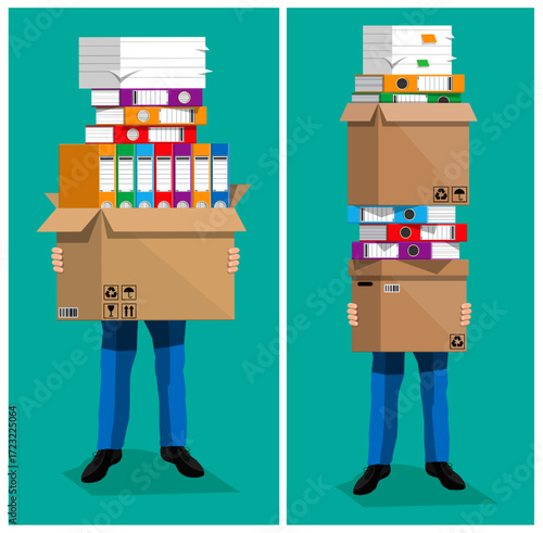 Man trying to move a lot of office paper documents in a box. Huge stacks of paper, files, and folders. Bureaucracy and overload concept.
