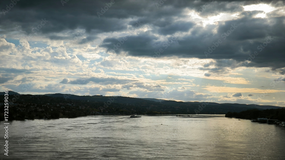 Fototapeta premium landscape by the Danube river in Novi Sad in autumn, with stormy clouds